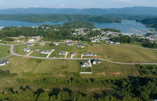 land, 0.41 acres, aerial view of neighborhood, lake, mountains