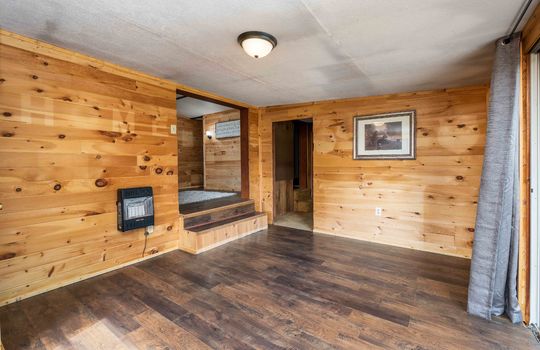 wood walls, laminate flooring, window