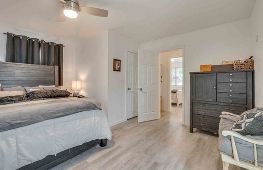primary bedroom, ceiling fan, view to hallway, Luxury vinyl flooring