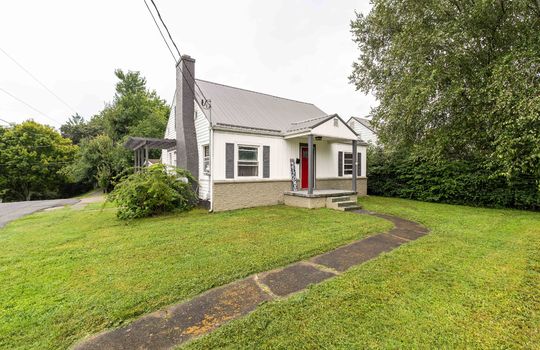 cottage, 1.5 story, sidewalk, front porch, side porch, chimney, aluminum siding, front door, front yard