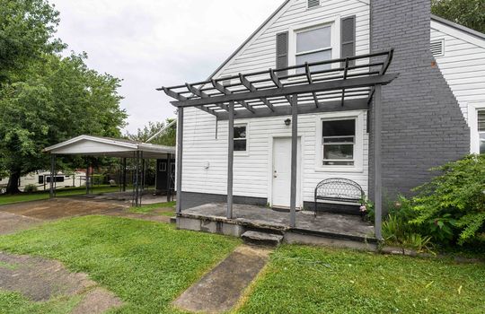 1.5 Story, cottage, aluminum siding, pergola, side porch, concrete pad, sidewalk, exterior door