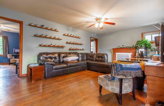 living room, fireplace, ceiling fan, hardwood flooring