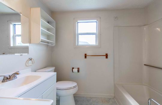 bathroom, toilet, shower/tub, sink, window