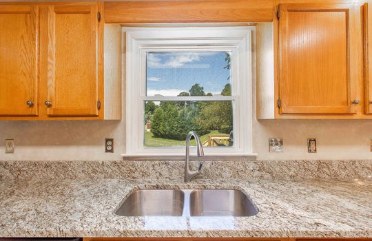 kitchen, granite countertop, cabinets, window, back yard view through window