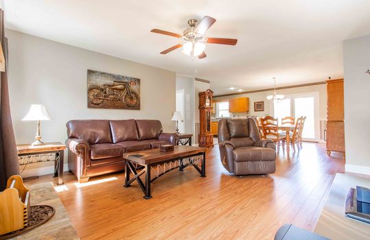 living room, open floorplan, ceiling fan, laminate flooring