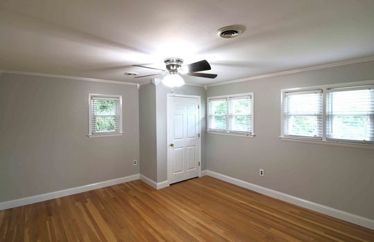 bedroom, hardwood flooring, closet, ceiling fan, windows