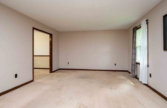 living room, carpet, window, doorway to dining area