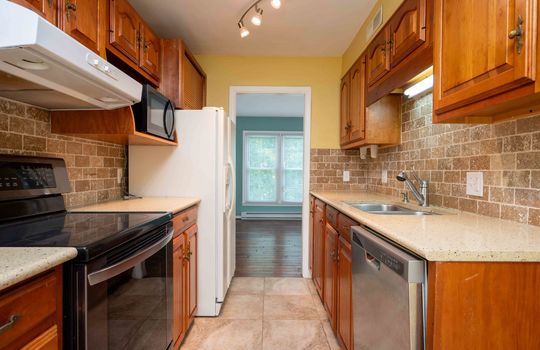 kitchen, granite counters, sink, stove, refrigerator, dishwasher, cabinets