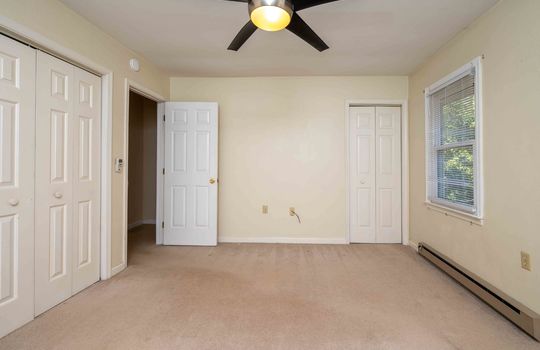bedroom, closets, carpet, window, ceiling fan, baseboard heating