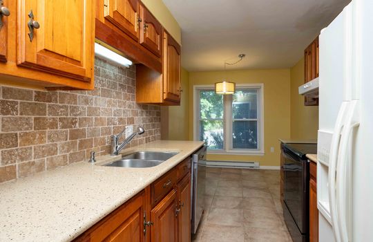 kitchen, granite counters, sink, stove, refrigerator, dishwasher, cabinets, eat in kitchen, baseboard heating