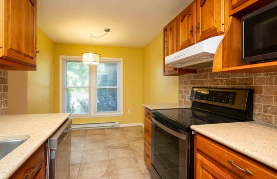 kitchen, granite counters, sink, stove, dishwasher, cabinets, eat in kitchen, baseboard heating