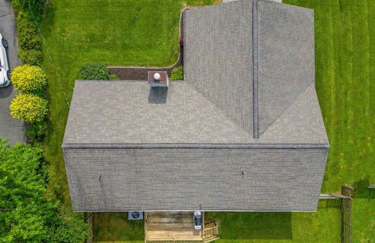 aerial view of property, roof, back deck, yard