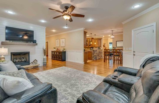 living room, hardwood flooring, recessed lighting, view into dining room
