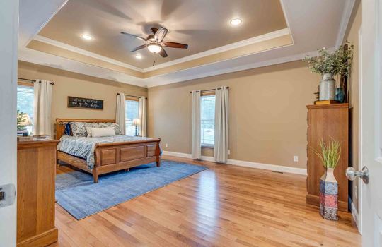 bedroom, tray ceilings, recessed lighting, ceiling fan, hardwood flooring