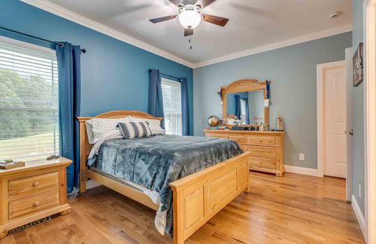 bedroom, hardwood flooring, ceiling fan, windows