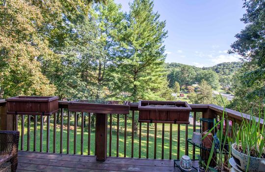 wood back deck, back yard, trees, mountain views
