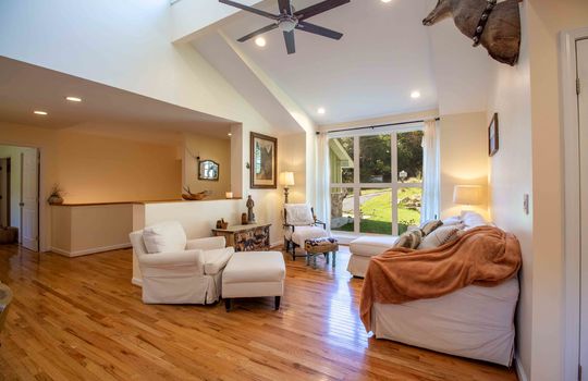 living room, windows, ceiling fan, hardwood flooring, vaulted ceilings, recessed lighting