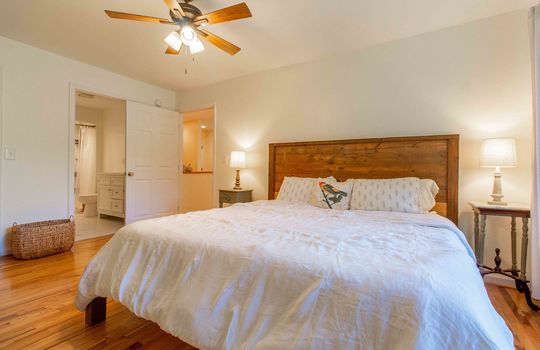 bedroom, closet, hardwood flooring, windows, ceiling fan, primary bedroom