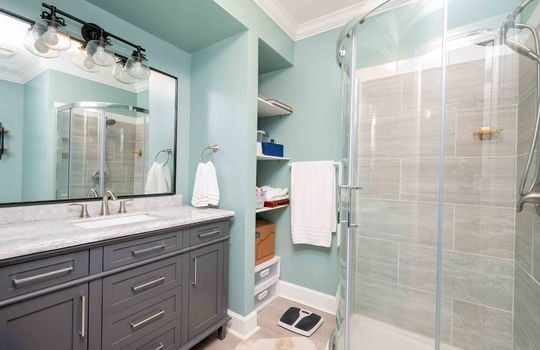 Level 2, bedroom 1 bath/ensuite, tile shower, storage, granite countertop,cabinet, sink