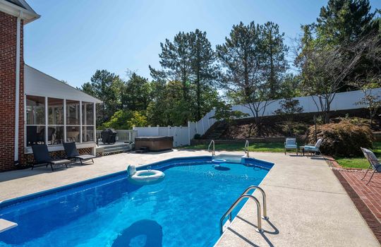 back yard, in-ground pool. landscaping, screened porch, wood back deck, hot tub, brick sitting area