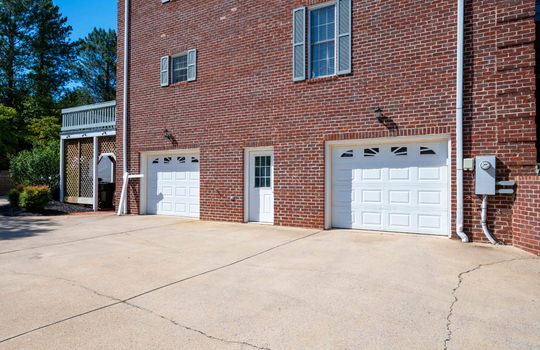 Driveway, garage doors, garage, brick exterior, exterior entry