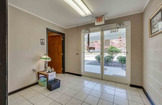waiting area, exterior door, tile flooring