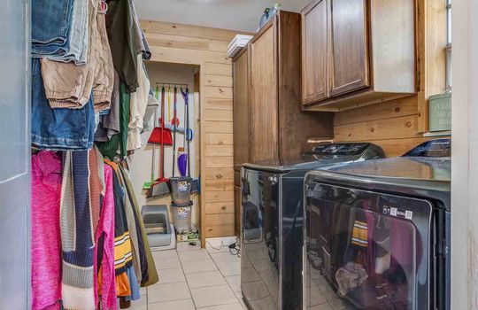 laundry room, cabinets, tile flooring, shelving