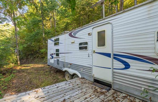 15.5 +/- acres of land, wooded, campground, second camper
