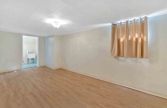 newly finished lower level, luxury vinyl plank flooring, window