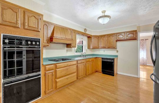 kitchen, hardwood flooring, double oven, dishwasher, sink, cabinets