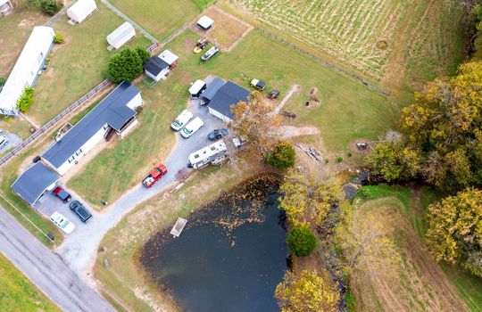 aerial view of land, 5.26+/- acres, pond, field, home, driveway