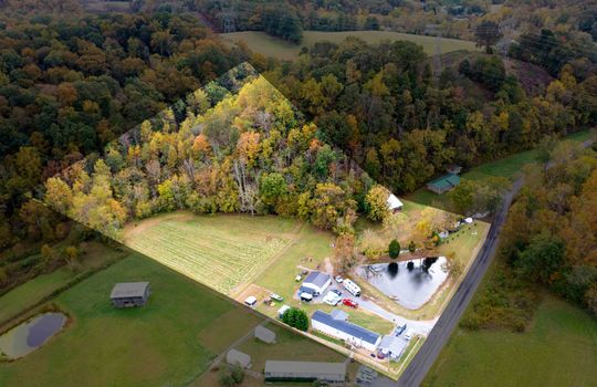 aerial view, property outline, pond, singlewide, two bay garage, field, trees, mountain views