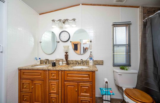 bathroom, double sink, toilet, shower/tub, window