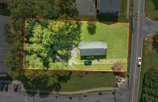 aerial view of property, driveway, road, roof, yard, property outline