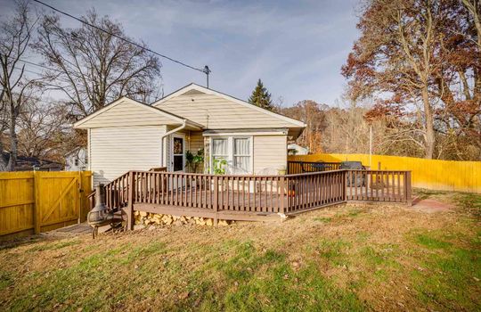 cottage, vinyl siding, yard, back deck, fence, windows, trees