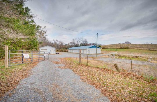 1.94+/- acres, two buildings, gravel driveway, gate, trees