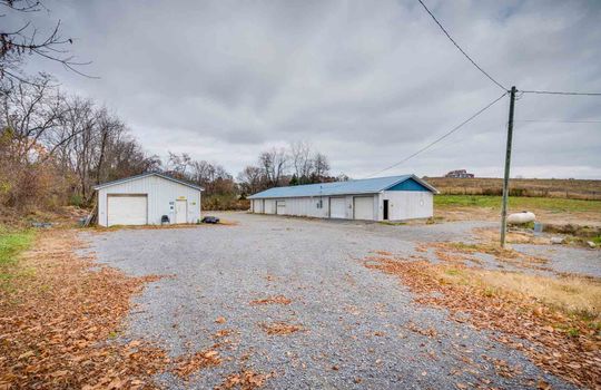 1.94+/- acres, gravel drive, two buildings, trees