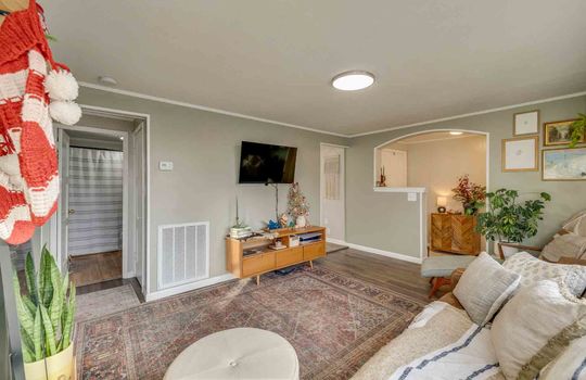 living room, view into entryway, vinyl flooring
