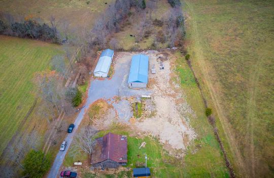 aerial view, 1.94+/- acres, two buildings, trees, gravel drive