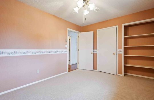 bedroom, carpet, ensuite bath, built in shelving