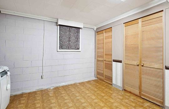 lower level living area, vinyl flooring