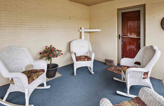 Sunroom, exterior door, outdoor carpeting, vinyl siding