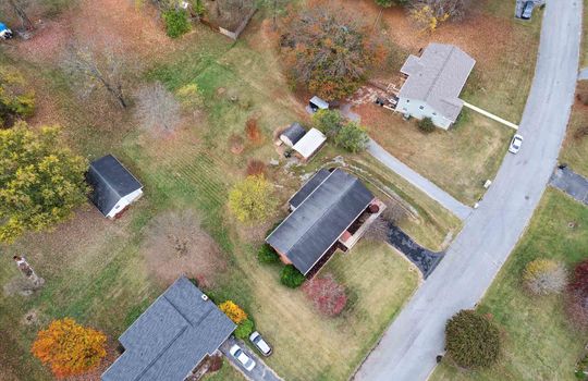 aerial view of property, neighboring properties, road, driveways