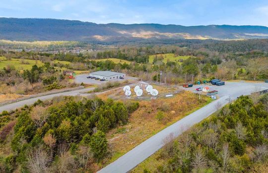 aerial view, commercial property, industrial property, 1.01+/- acres, road frontage, trees, mountain view, satellite dishes