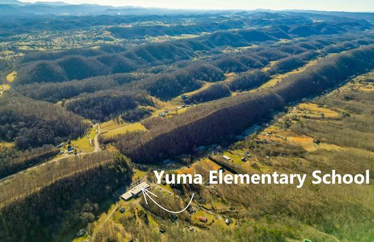 Aerial view of property showing proximity to Yuma Elementary School