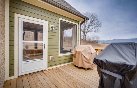 wood back deck, door to screened in porch/sunroom