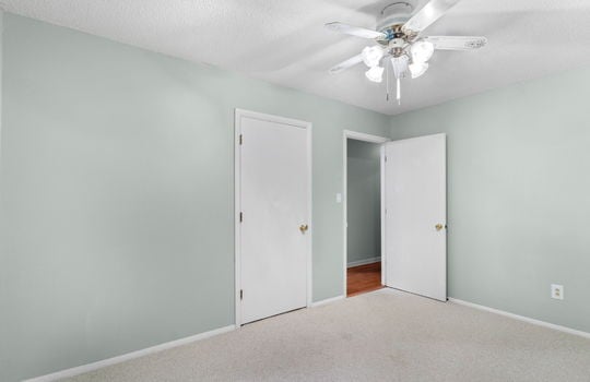 freshly painted bedroom, ceiling fan, closet, carpet