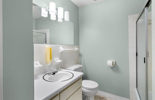 freshly painted ensuite bathroom, sink, toilet, shower/tub, sliding shower door