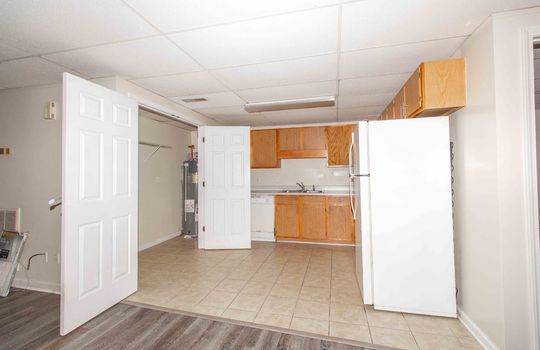 unit 1, kitchen, tile flooring, laundry area, refrigerator, stove, dishwasher, sink, cabinets, counter, refrigerator