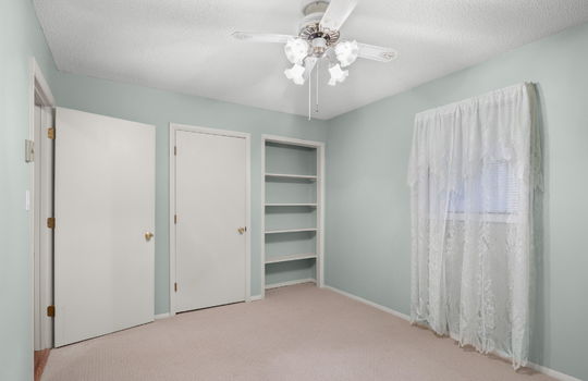 freshly painted bedroom, shelving, closing, carpet, ceiling fan